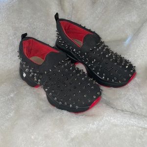 Cute black and red spiked running shoes